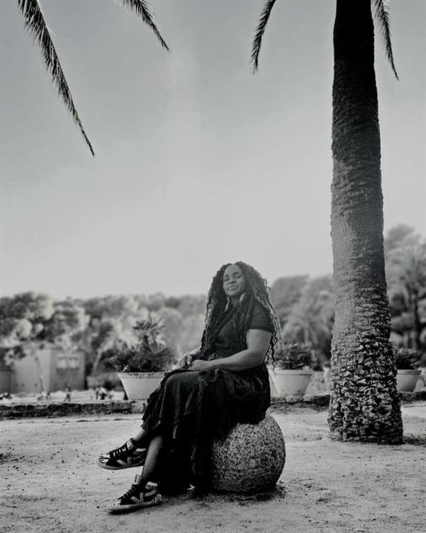 portrait of kamilah under palm trees